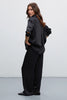 Black satin trousers with pleats