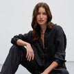 Black satin trousers with pleats