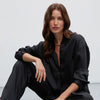 Black satin trousers with pleats