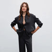 Black satin trousers with pleats