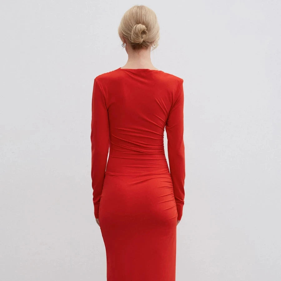 Red midi dress with gathers made of knit fabric.