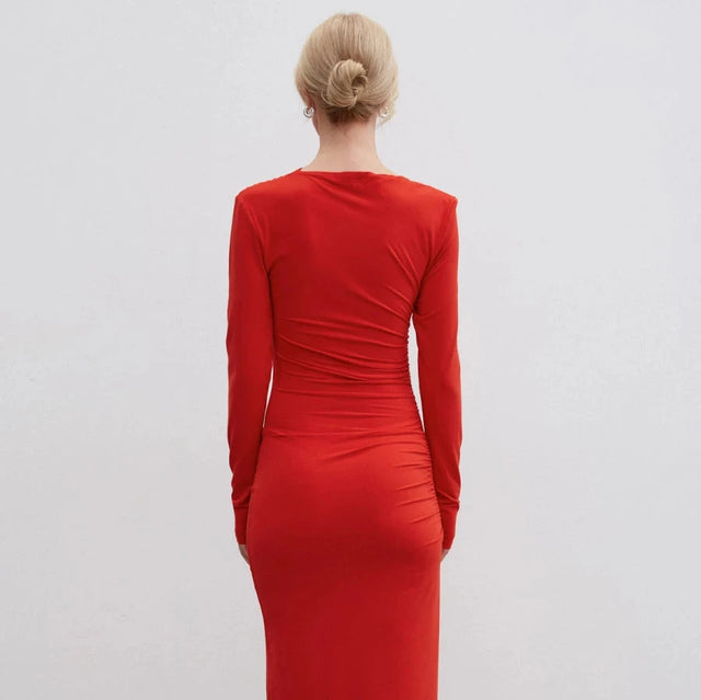 Red midi dress with gathers made of knit fabric.