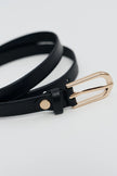 Black leather belt with a semicircular gold buckle